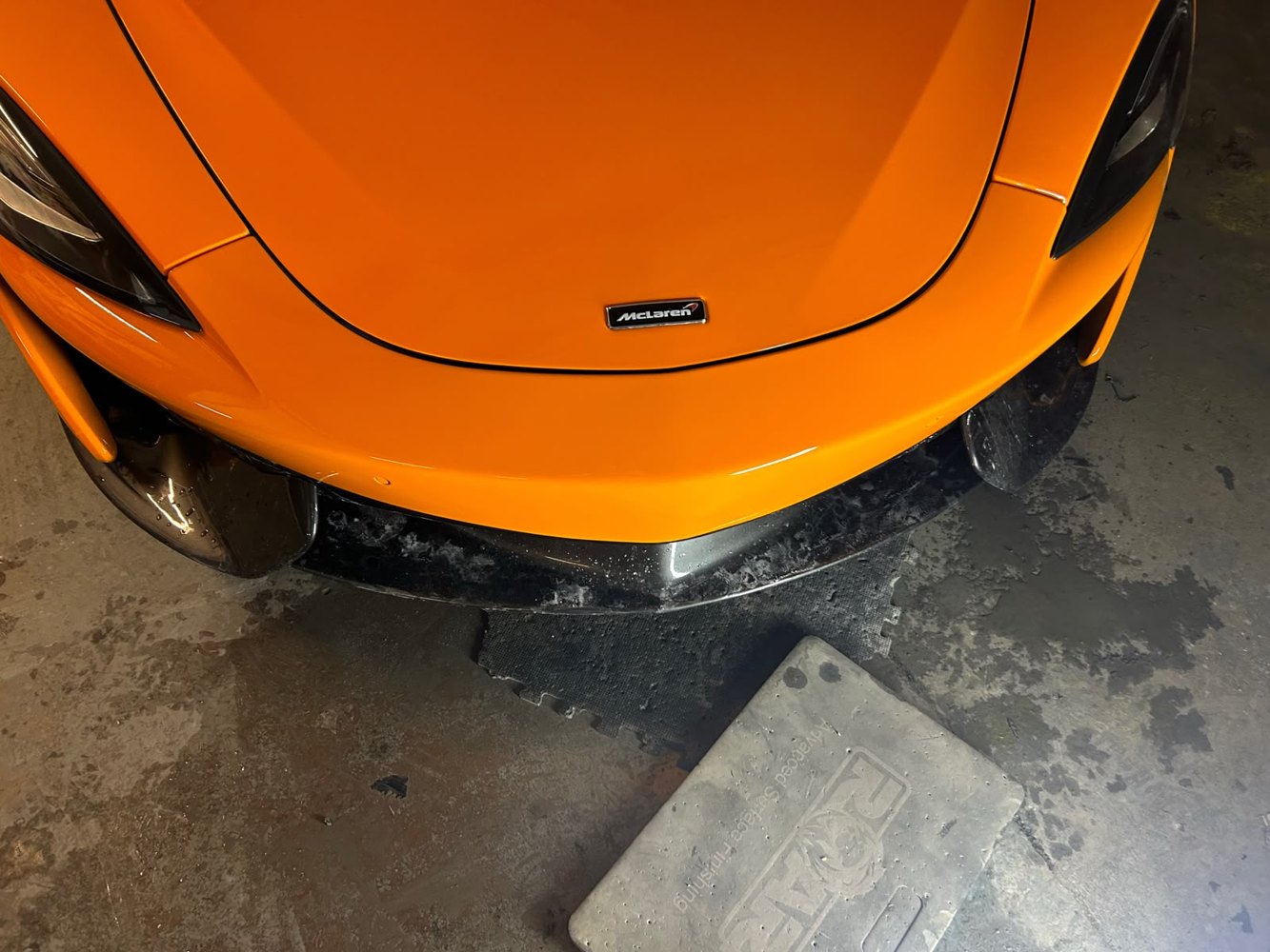 Freshly resprayed orange sports car bodywork at Cezary Car Body Repairs