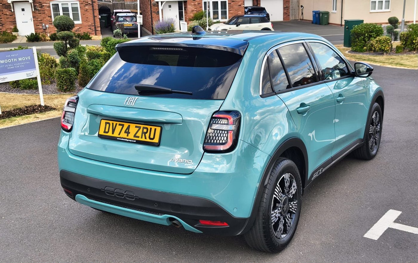 The same blue Fiat after panel repair and refinishing, damage no longer visible