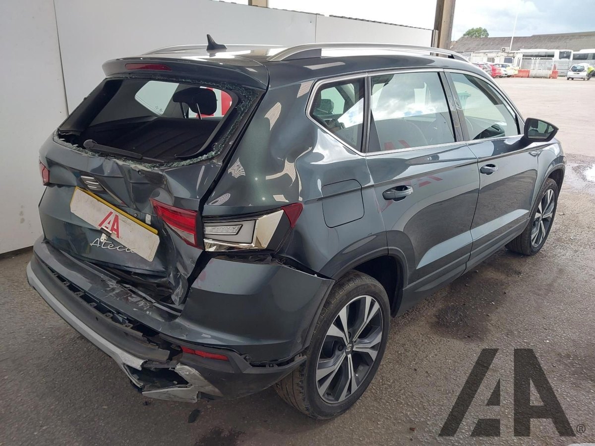 Rear damage assessment on a grey SUV before repair